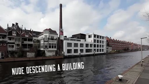 Nude descending a building