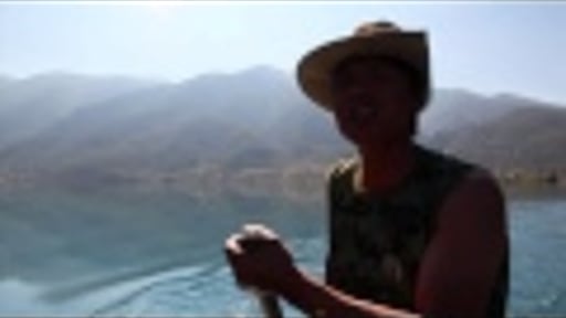 The Singing Rower at Lugu Lake, China