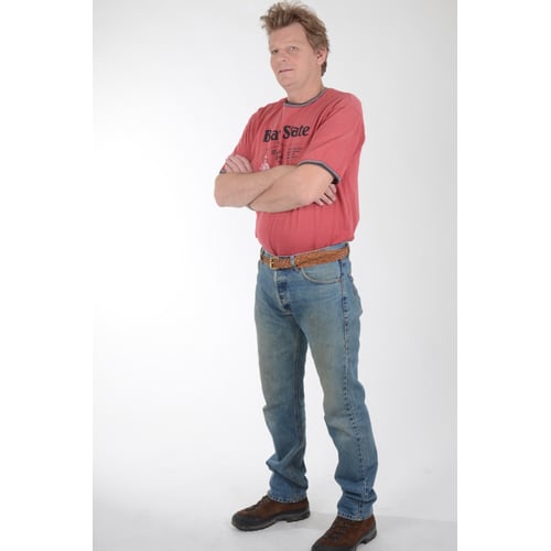 Dutch Actor Peter Rene as a Construction Worker in Workwear, Standing Upright Arms Crossed Looking Aside