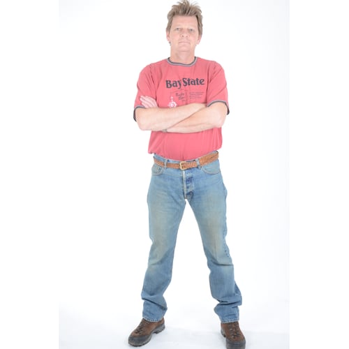 Dutch Actor Peter Rene as a Construction Worker in Workwear, standing arms crossed 