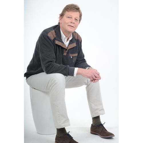 Dutch Actor Peter Rene as a Chique Person in Casual Clothing, Sitting Oblique Looking Aside